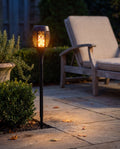 Luxent Flicker — solar flame torch with a realistic dancing fire effect along the edge of a patio